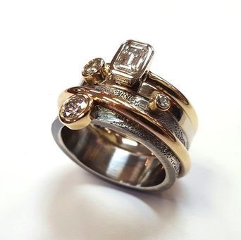 Trios contemporary ring restyled from family gems.